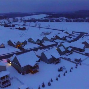 Dusk flight over the snow